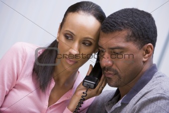 Couple listening to news over phone