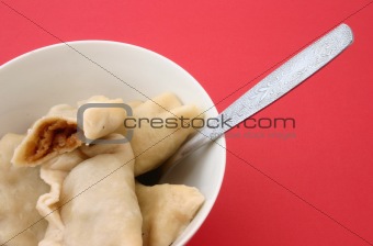 bowl of traditional Polish dumplings with cabbage