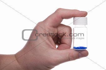 Hand with blue vial