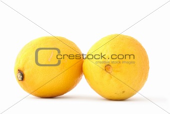 two fresh lemons on white