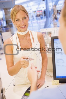 Woman paying in store