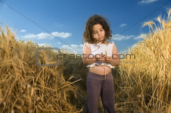 little girl in a wheat field