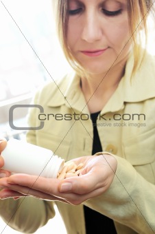 Mature woman with pills