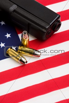 gun and bullets on flag