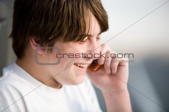 teenager on cellphone laughing