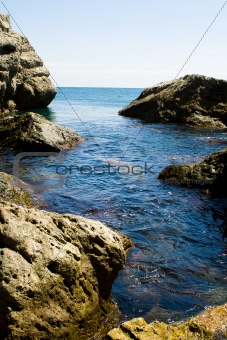 Sea tide between rocks