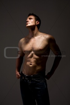 handsome topless man in jeans