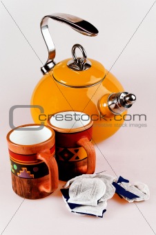 isolated tea pot with handmade mugs