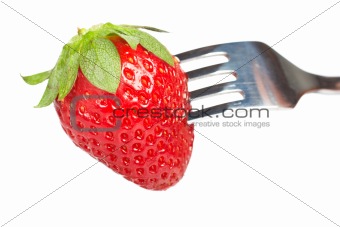 The fork pricking the strawberry