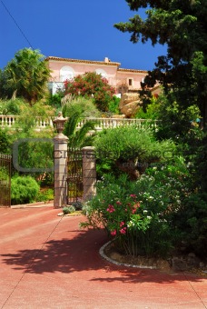 Lush garden in front of a villa