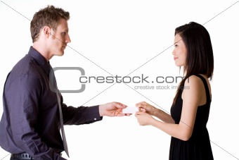 businessman exchanging name cards with woman
