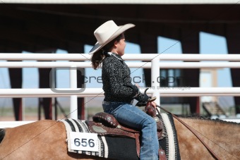Young girl competing at horse show