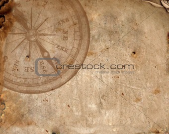 Compass on the old paper 