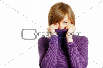 attractive young woman hiding in the turtleneck