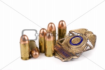 Police badge and bullets
