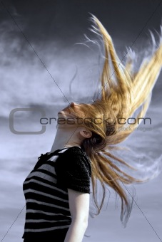 Sexy young woman with hair in the air