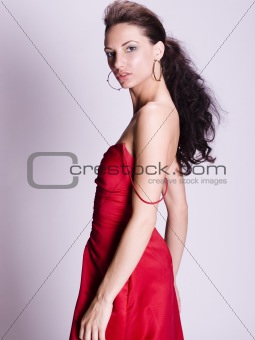 Young woman wearing a red evening gown