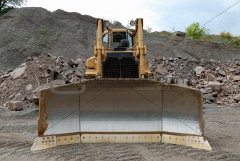 Huge bulldozer in a stone pit