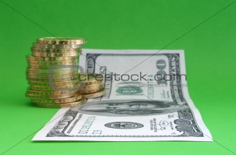 One hundred dollar note with coins