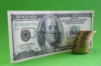 One hundred dollar note with coins