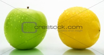 Green apple and lemon with water drops