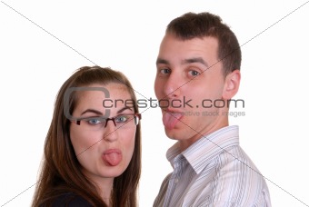 attractive young couple poke tongues out