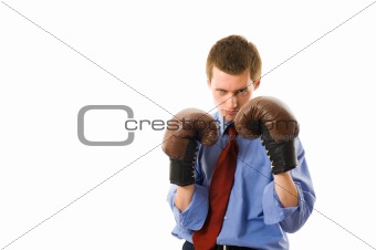 The young business man defends. Isolated over white background
