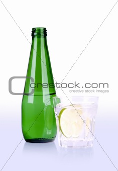 glass of and bottle with path
