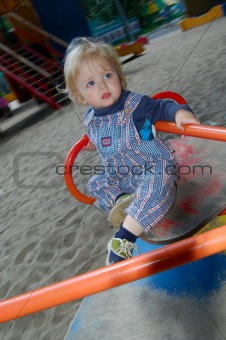 baby on merry-go-round