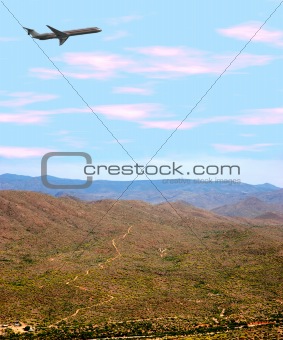 Airplane Over Desert