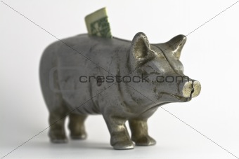Old Piggy Bank with Dollar Bill