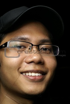 Smiling young asian man portrait