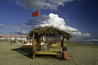 Wide hut on the beach in Italy