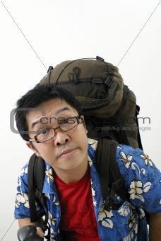 Tired asian holiday backpacker