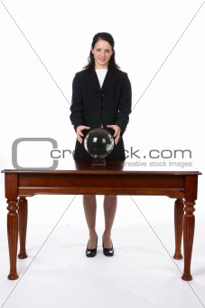 business woman with her hands on a crystal ball.
