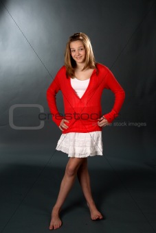 Pretty teenage girl in a red sweater