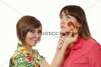 two pretty girls making up together