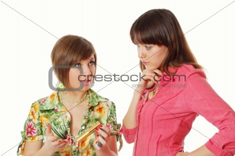 One girl giving an advice about cosmetic to another