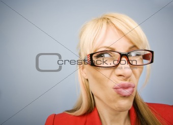 Disgusted woman in red making a funny face
