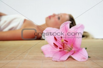 beauty portrait of a woman with a flower