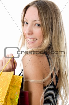 Happy Young girl holding bags