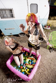 Women Splashing in a Play Pool