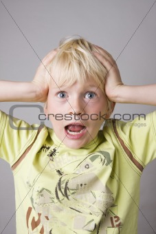 Portrait of a young boy shouting