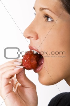 Bitting into a strawberry