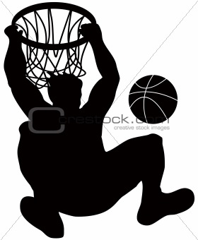 Basketball player hanging on to the hoop after dunking ball