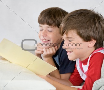Boys Reading a Story in Bed