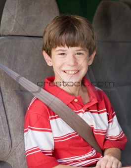 Boy With Seatbelt on Riding in Car