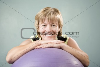 Woman Leaning on an Exercise Ball