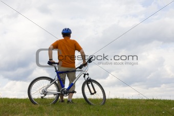Man standing by his mountain bike