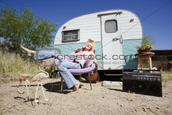Woman in front of Travel Trailer